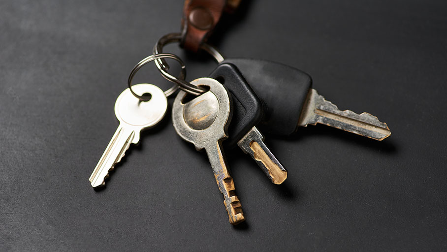 Bunch of keys on the black surface