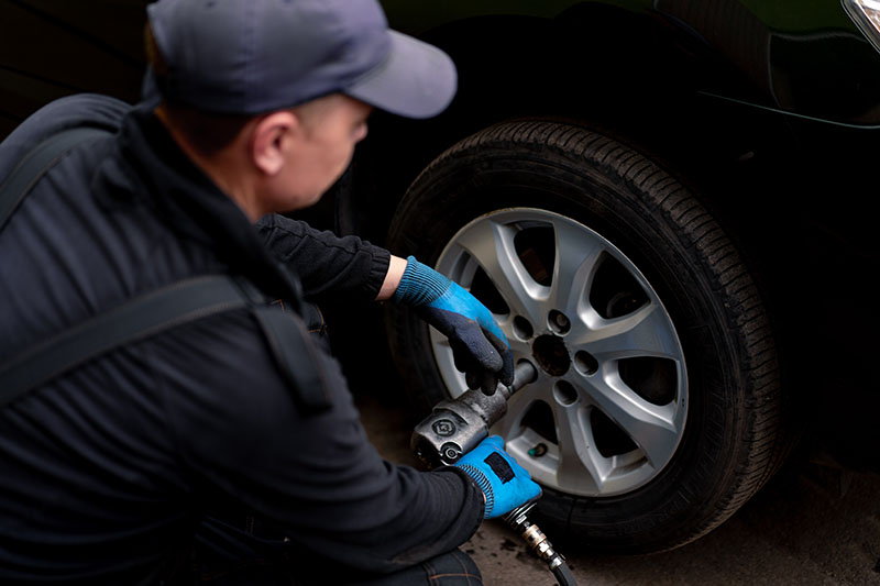 Professional tire installation in process.