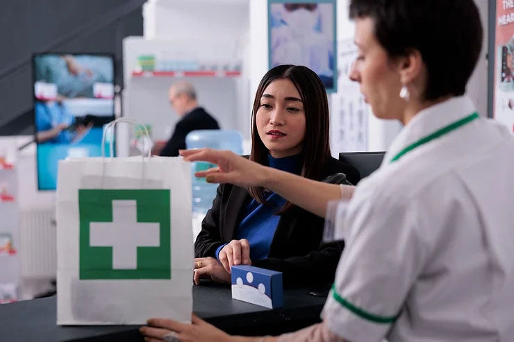 Customer buying from a pharmacy.