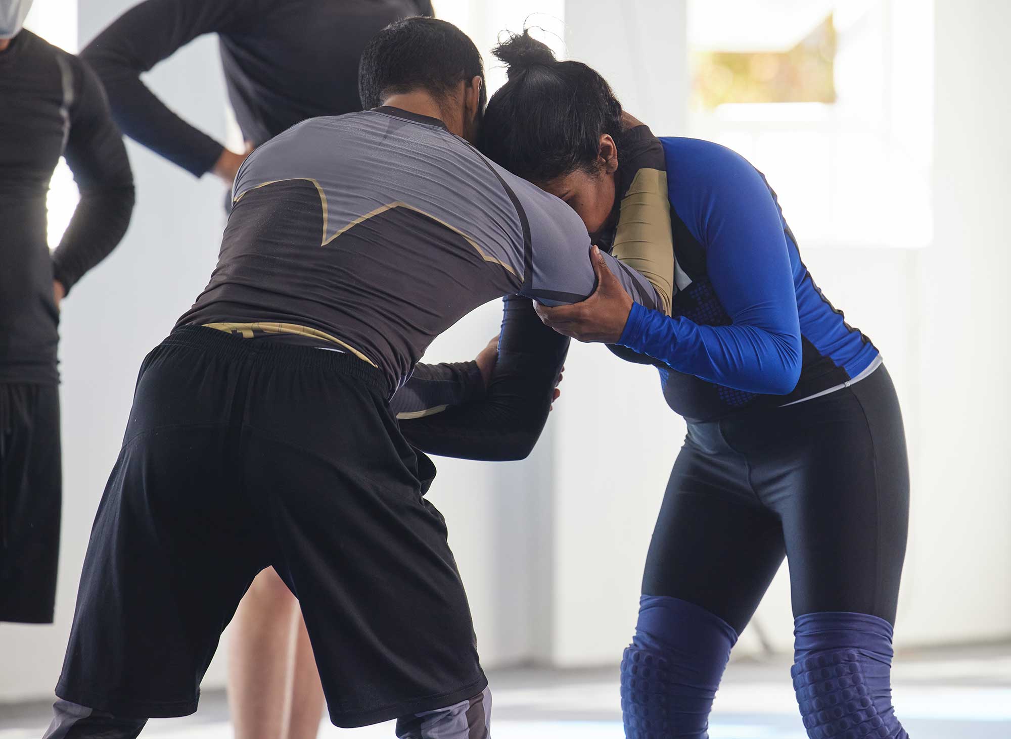 Students practicing mixed martial arts (MMA) techniques 